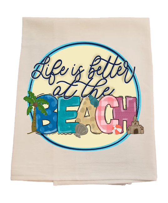 Beach-themed towel with 'Life is better at the Beach' text and beach elements.