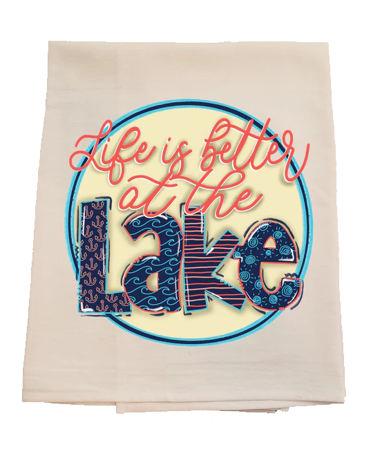 Beige towel with 'Life is better at the Lake' text design on a white background