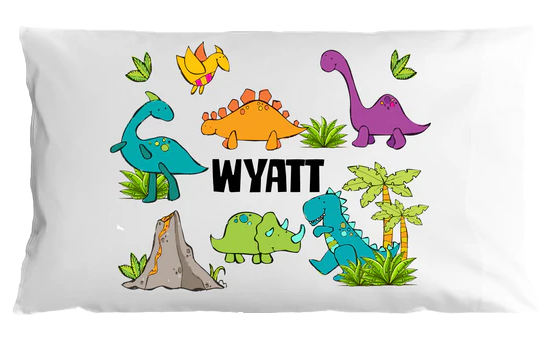 Pillow case with colorful dinosaurs and the name 'Wyatt' on a white background