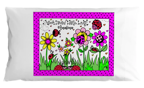 Children's pillowcase with colorful flowers, ladybugs, and personalized text on a white background.