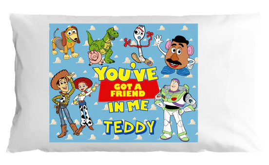 Pillow with Toy Story characters and text 'You've got a friend in me Teddy' on a white background