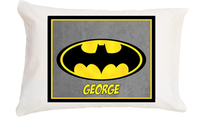 Pillow with Batman logo and name 'George' on a gray background