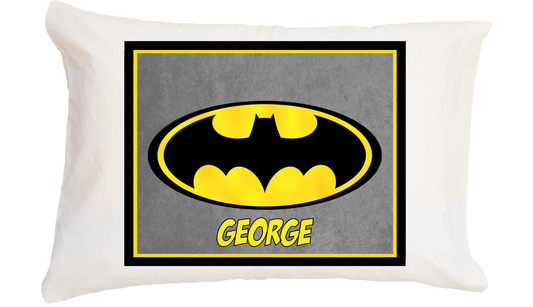 Pillow with Batman logo and name 'George' on a gray background