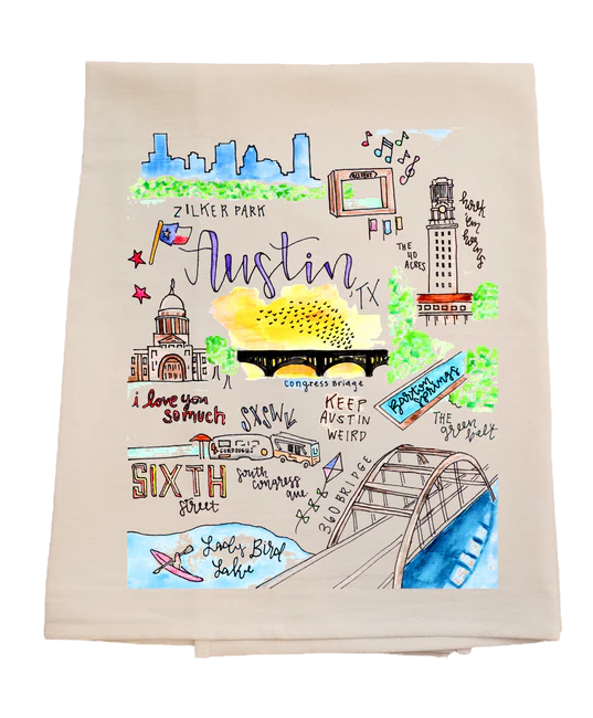 Beige towel with colorful illustrations of Austin landmarks and text on a white background