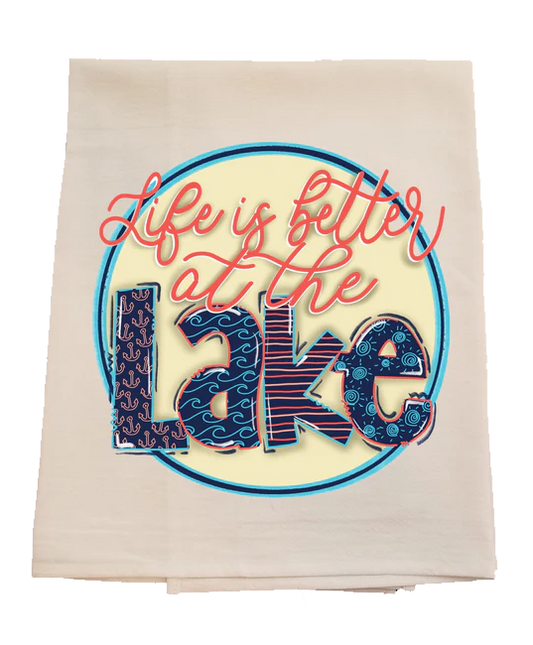 Beige towel with 'Life is better at the Lake' text design on a white background