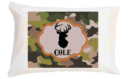 Pillow with camouflage pattern and deer silhouette design featuring the name 'Cole'.