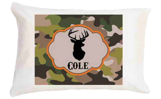 Pillow with camouflage pattern and deer silhouette design featuring the name 'Cole'.