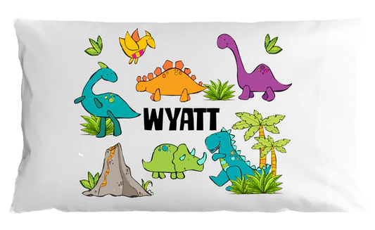 Pillow case with colorful dinosaurs and the name 'Wyatt' on a white background