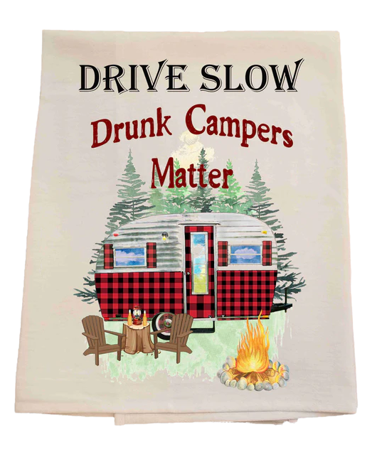 Tea towel with a campervan, chairs, and bonfire design, featuring the text 'Drive Slow Drunk Campers Matter'.