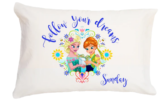 Pillow with cartoon characters and text 'Follow your dreams Sunday' on a white background