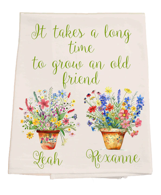 Decorative towel with floral designs and text on a white background