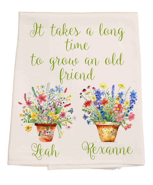 Decorative towel with floral designs and text on a white background