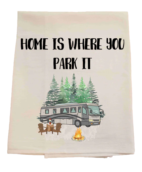 Tea towel with an RV and 'Home is where you park it' text on a pastel background