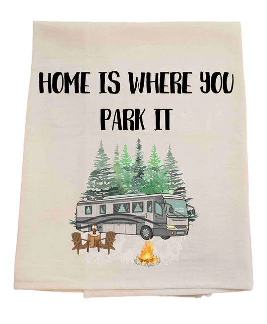 Tea towel with an RV and 'Home is where you park it' text on a pastel background