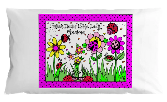 Children's pillowcase with colorful flowers, ladybugs, and personalized text on a white background.