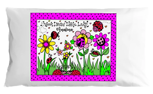 Decorative pillow with colorful ladybug and flower design on a white background