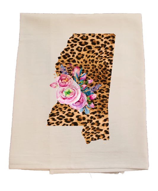Beige towel with a leopard print and floral design in the shape of the state of Alabama.