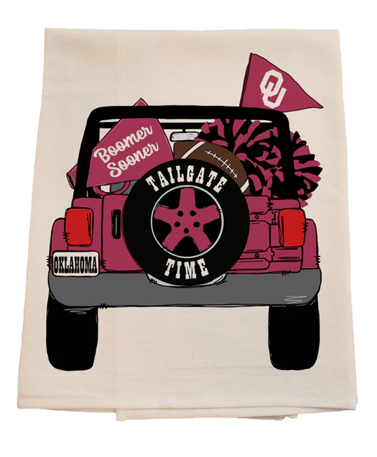 Beige towel with a graphic of a pink jeep, football, and 'Tailgate Time' text on a white background
