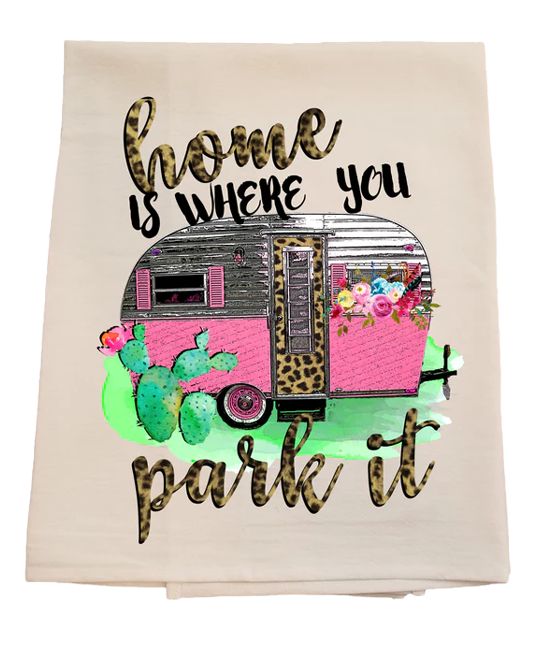 Decorative towel with a pink camper, flowers, and cacti design on a white background.