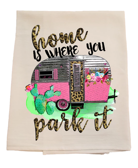 Decorative towel with a pink camper, flowers, and cacti design on a white background.