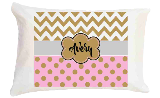 Personalized pillow with chevron and polka dot pattern and 'Avery' on a white background