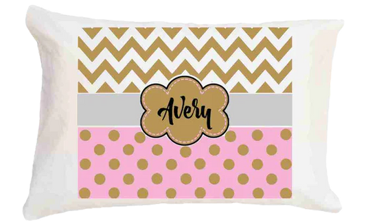 Personalized pillow with chevron and polka dot pattern and 'Avery' on a white background