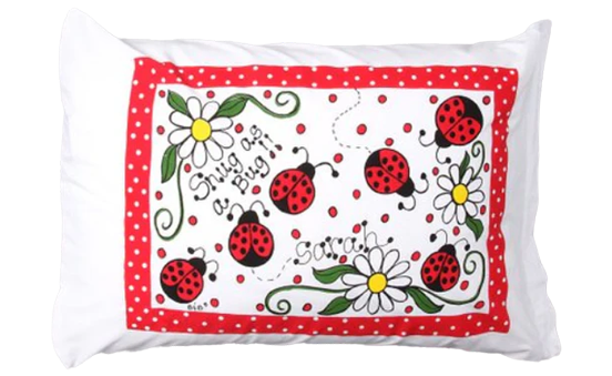 Decorative pillow with ladybug and flower pattern on a white background