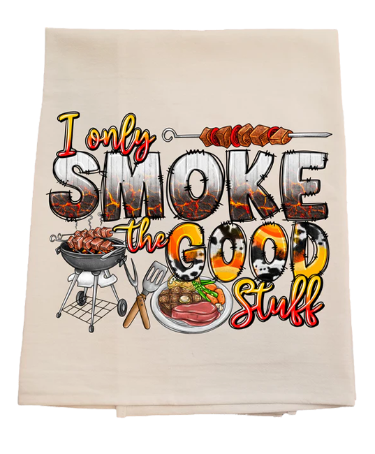 Beige towel with barbecue-themed text and graphics on a white background