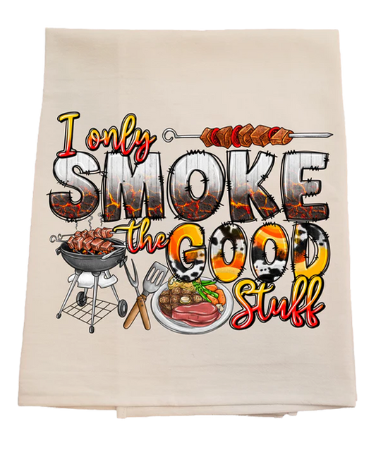 Beige towel with barbecue-themed text and graphics on a white background