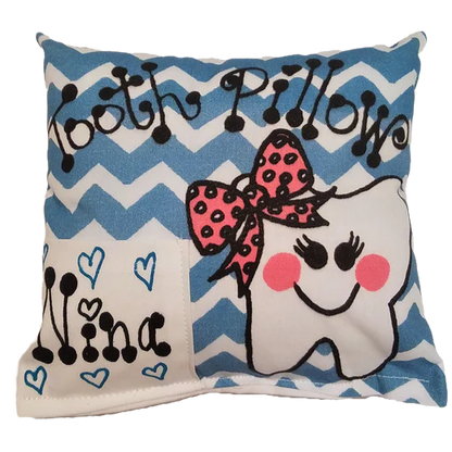 Decorative pillow with a cartoon tooth design and blue chevron pattern