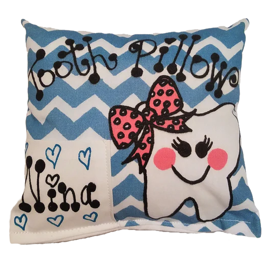 Decorative pillow with a cartoon tooth design and blue chevron pattern
