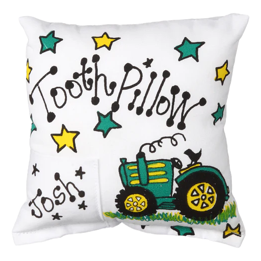 Children's tooth pillow with a cartoon tractor and colorful stars on a white background