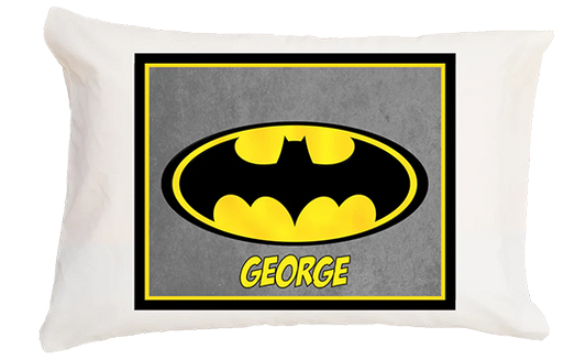 Pillow with Batman logo and name 'George' on a white background