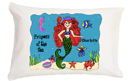 Decorative pillow with a mermaid design and personalized text on a white background