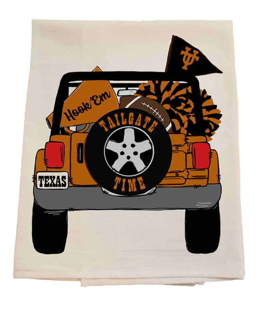 Decorative towel with a graphic of a jeep, tailgate, and football-themed text on a white background.