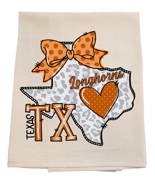 Decorative towel with Texas Longhorns design featuring a bow, heart, and state outline.