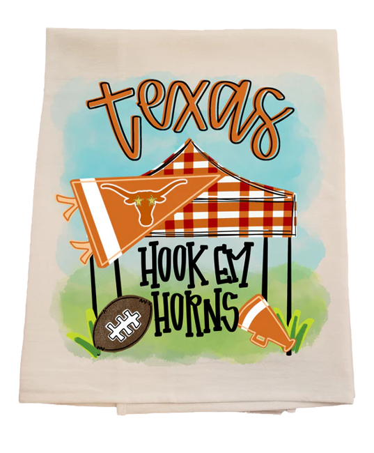 Decorative towel with 'Texas' and 'Hook 'em Horns' text, featuring a plaid tent and football.