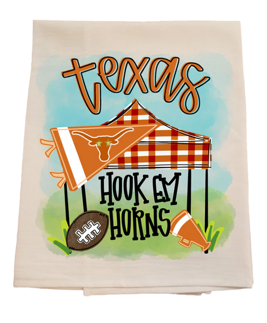 Decorative towel with 'Texas' and 'Hook 'em Horns' text, featuring a plaid tent and football.
