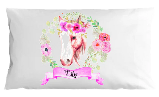 Pillow case with a unicorn design and floral elements on a white background