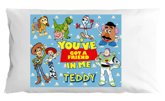Pillow with Toy Story characters and text 'You've got a friend in me Teddy' on a white background